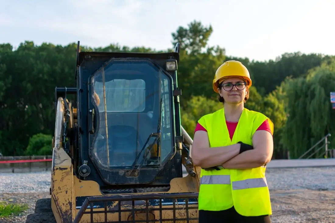 Site worker in a hard hat and high-visibility vest